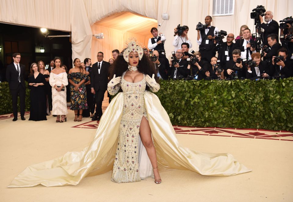  Cardi B was well into her pregnancy when she stunned the crowd in a custom gem-encrusted Moschino gown by Jeremy Scott