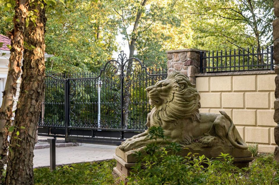  A huge stone lion guards the gates of the property