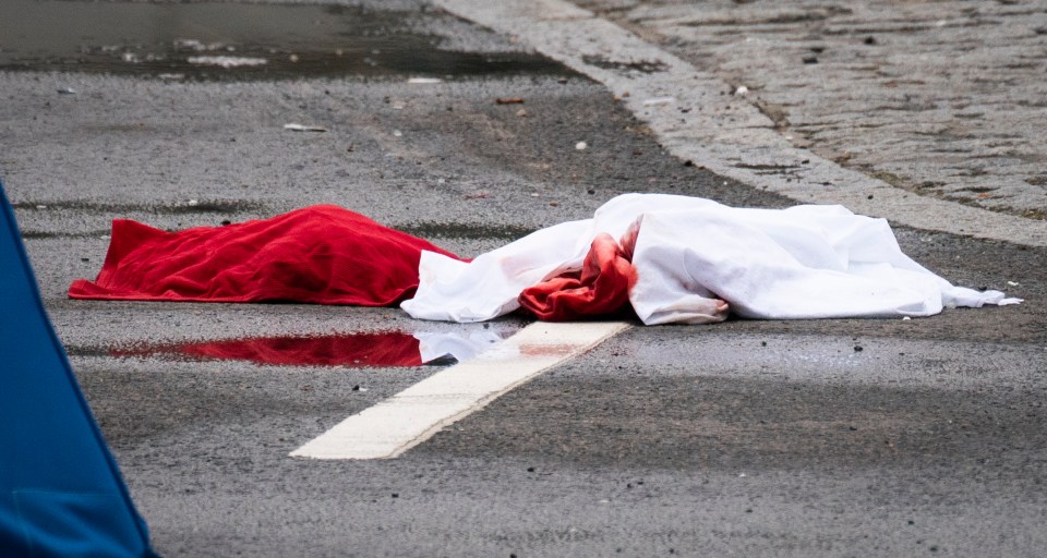  Bloodstained clothes were pictured at the scene of the knife attack