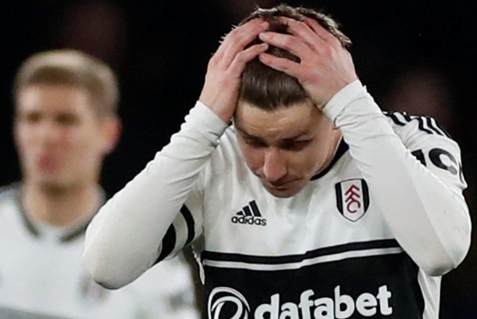 Tom Cairney shows the dejection of Fulham as they slump to a relegation-sealing defeat