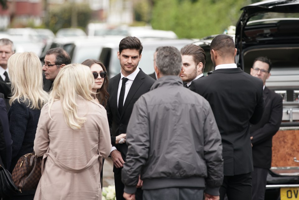  Mike's brother Nick Thalassitis waits outside the church with loved ones