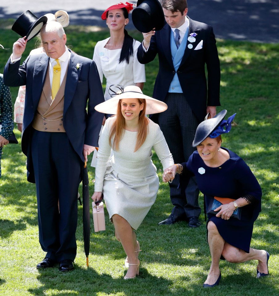 Prince Andrew doffs his hat as Princess Beatrice and the Duchess of York curtsy as the Queen passes at Royal Ascot