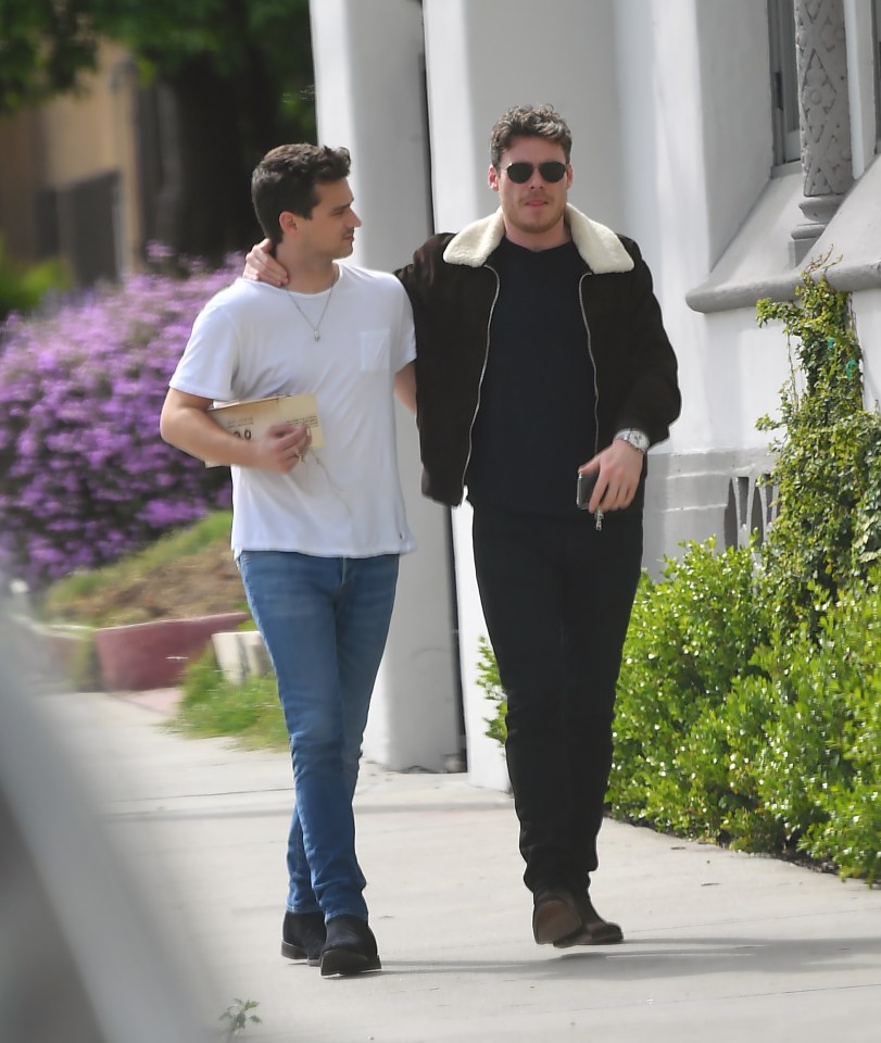  Bodyguard hunk Richard Madden and his US actor friend Brandon Flynn were spotted strolling around  LA, clutching a packet of cannabis cigarettes