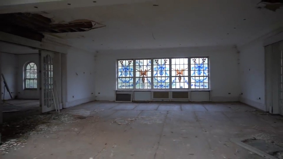  A stained-glass window remains intact amongst the decaying ruins in one mansion