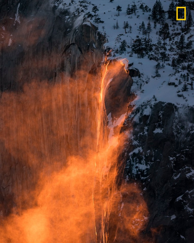  Photographer Daniel Yee said: 'The famous "Firefall" of Yosemite National Park is a natural phenomenon that occurs when the Horsetail Falls waterfall glows orange due to the angle of sunlight hitting the water, and will only occur when certain time and weather conditions are met. Some firefalls may glow a pale yellow, while others may glow like burning fire. I was lucky to witness the latter combined with strong winds, creating a spectacular sight. I went the extra mile up a snowy mountain to get the eye level shot.'