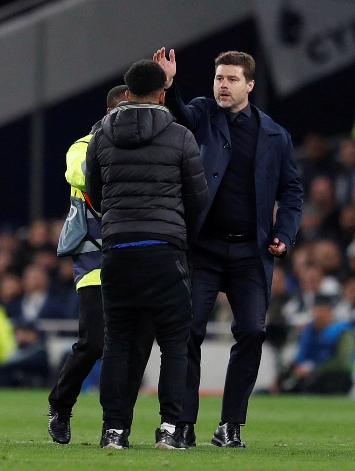 Pochettino gave the pitch invader a stern talking-to as he was escorted off