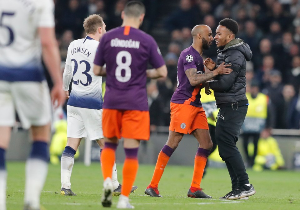 Fabian Delph attempted to usher the pitch invader off the pitch