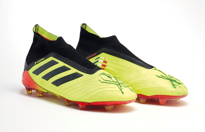  Pogba has signed the boots and the money raised will go to help kids in the Paris suburbs he came from