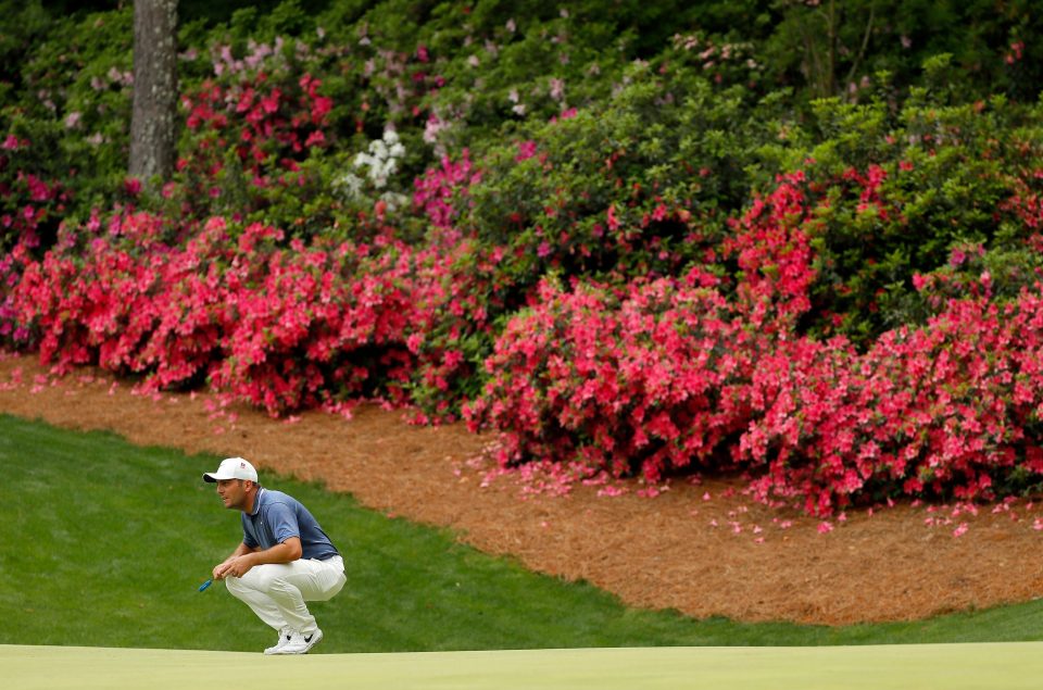  Francesco Molinari lines up a putt on the 13th green on Friday