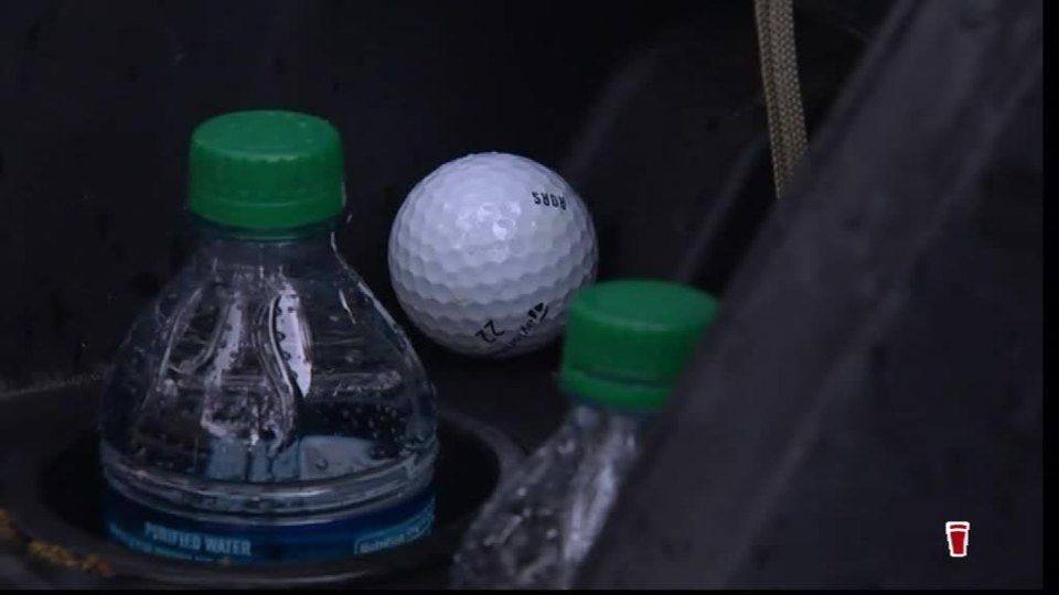  The ball was nestling between two water bottles in the glove box