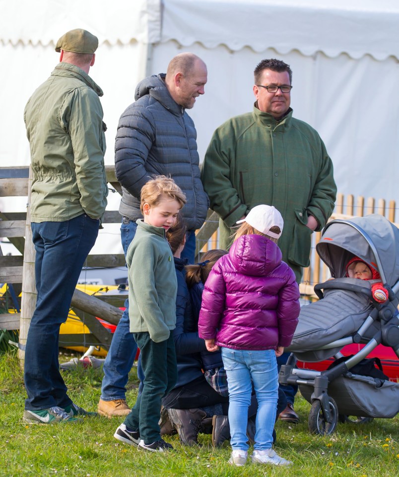 Mia opted for a stylish purple puffer jacket while George kept it casual with trainers