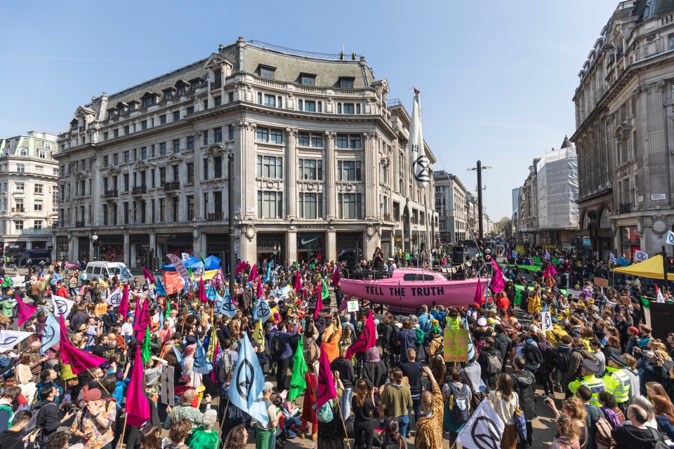 Thousands of protesters have descended on landmarks in London - seen here blocking Oxford Circus