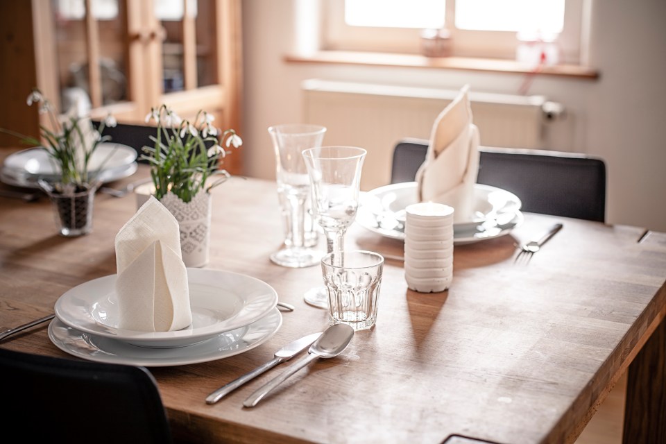  Adding flowers and a table runner can give your table a high-end look