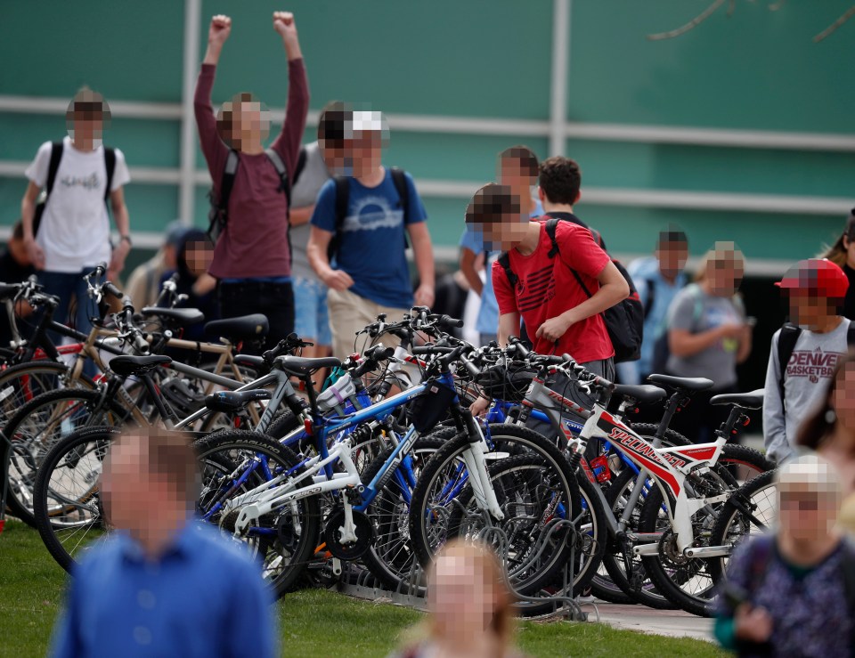  Students leave Columbine High School late on Tuesday following a lockdown