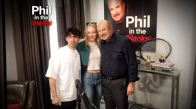  She credited Joe, pictured with Dr Phil, for getting her through the troubles