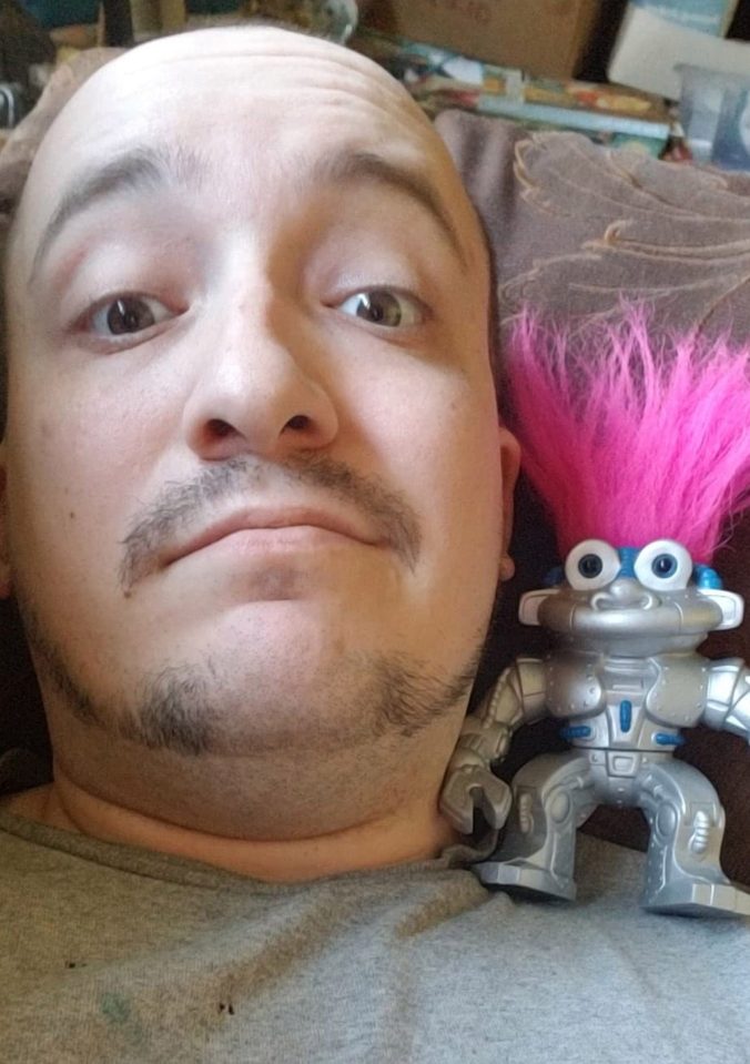  Joey Morris, 29, with his partner, RoboTroll who he started a relationship with in December 2017