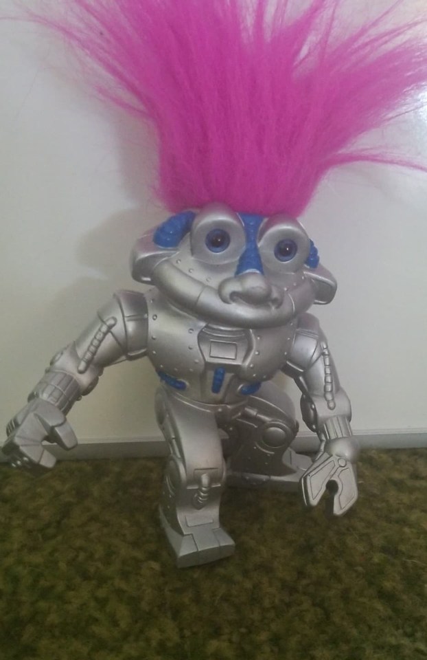  Joey says its RoboTrolls popping pink hair and satisfied smile that does it for him