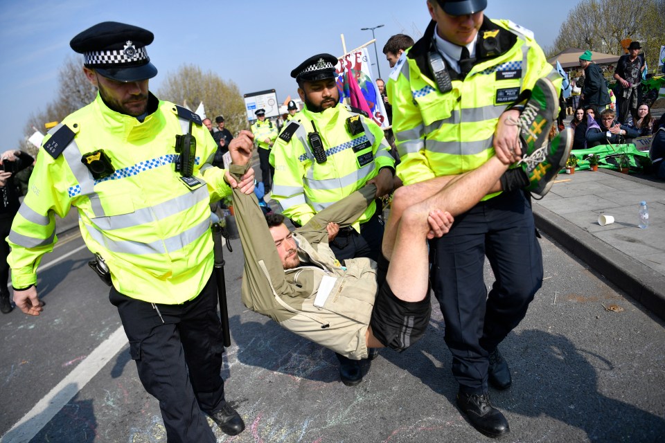  An activist is removed from the blockade at Waterloo Bridge