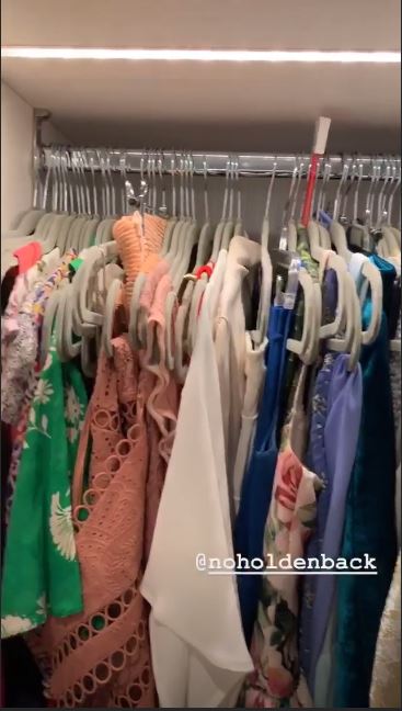 The clothes were arranged and hung on the matching hangers to create a more ordered space