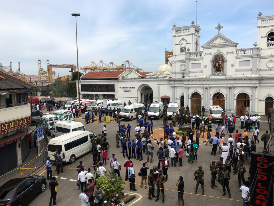 Sri Lankan military officials stand guard in front of St Anthony's Shrine