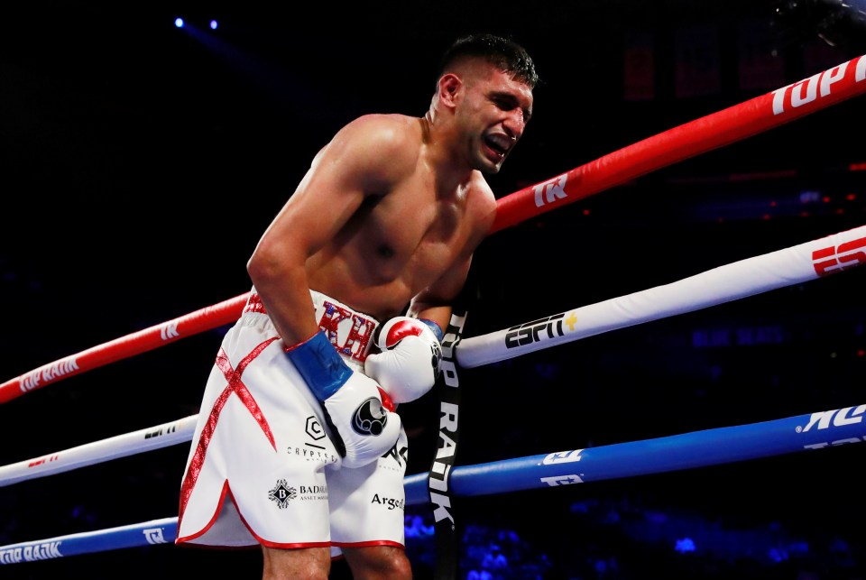 Amir Khan quit against Terence Crawford after a round-six low blow from the American champ