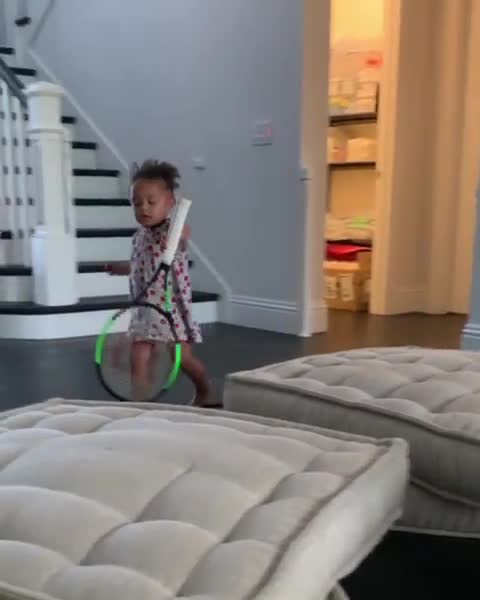  Little Olympia plays with tennis rackets in a video the American tennis star shared on Instagram