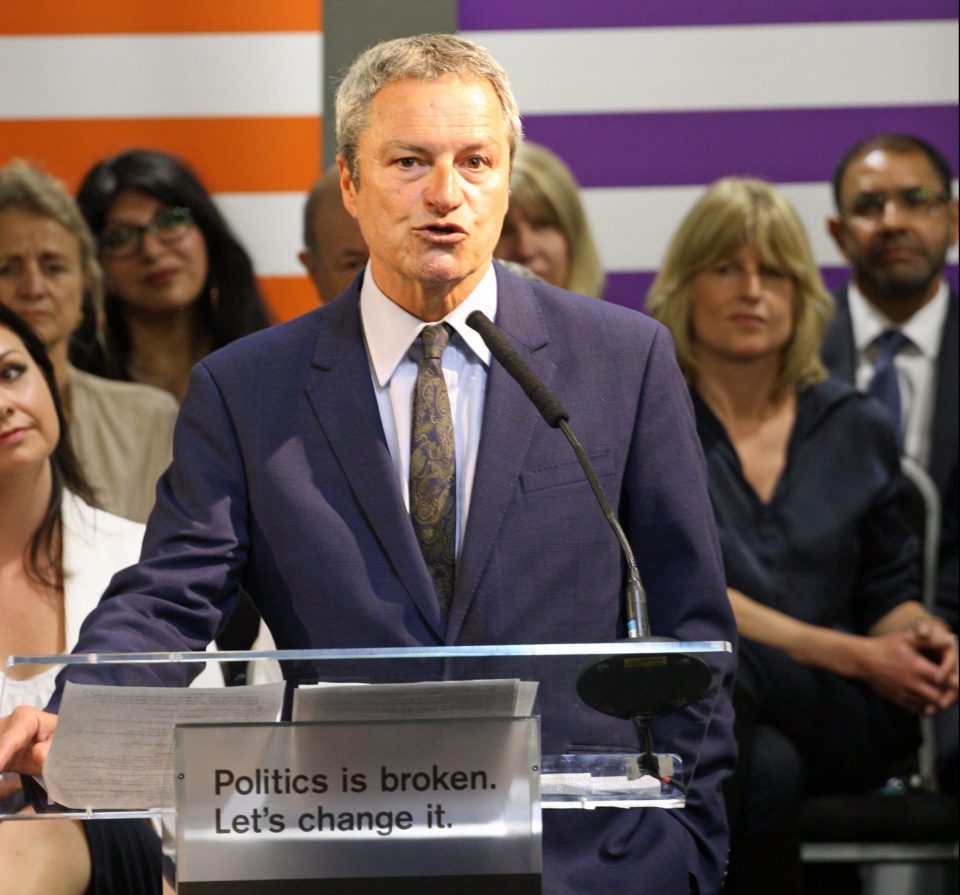  Ms Johnson, right, listening to ex-BBC presenter Gavin Esler today