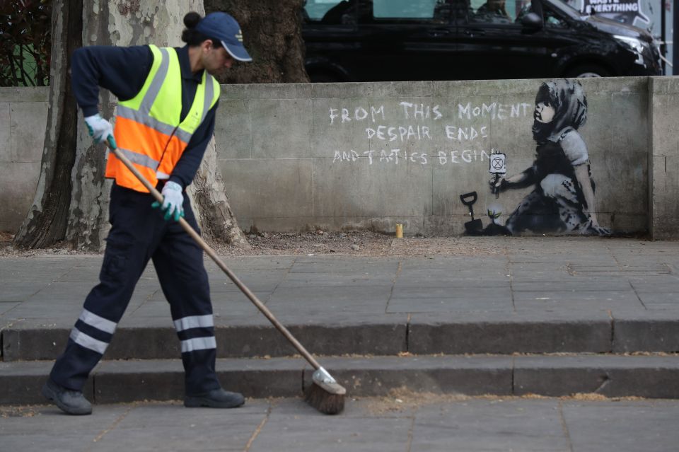  The suspected Banksy mural appears to be in support of the Extinction Rebellion movement