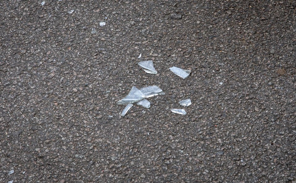  Pictures show broken glass left on the floor after one of the victims smashed a glass bottle over the attacker's head in a bid to escape