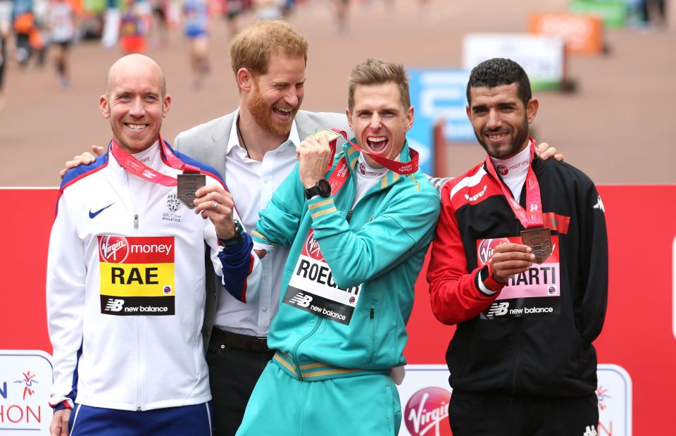  Harry appeared relaxed as he joked with some of the medal winners after the race