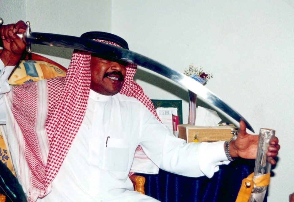  A Saudi executioner shows off his razor-sharp sword