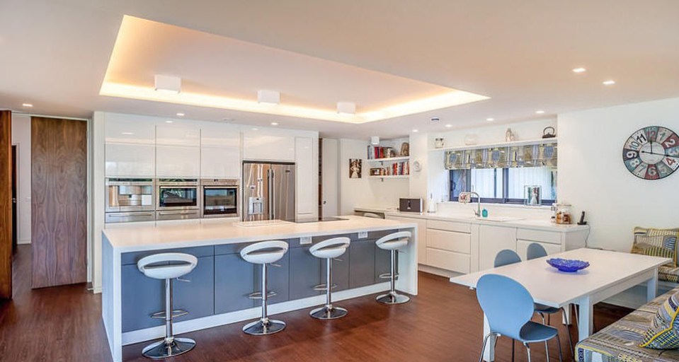 The stunning kitchen complete with breakfast bar