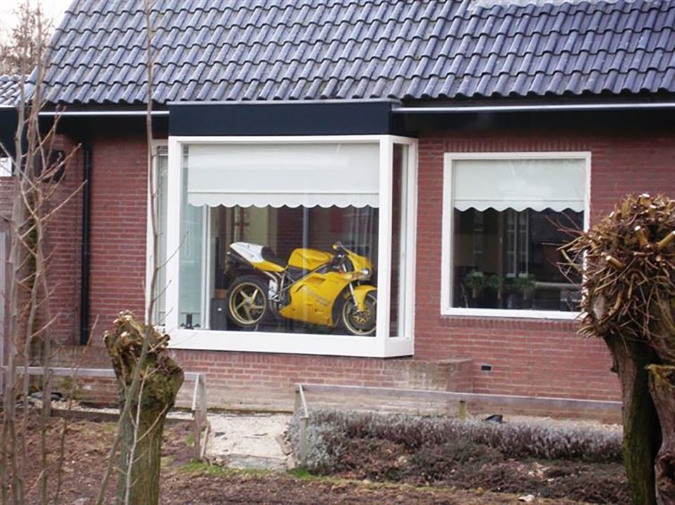  If you have a nice motorbike, why not show it in your living room window?