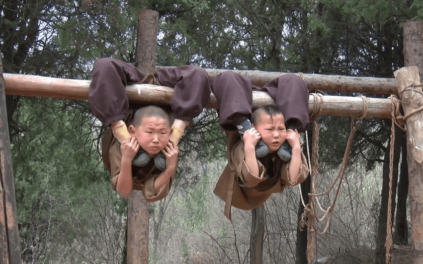  Others can be seen hanging painfully from bars