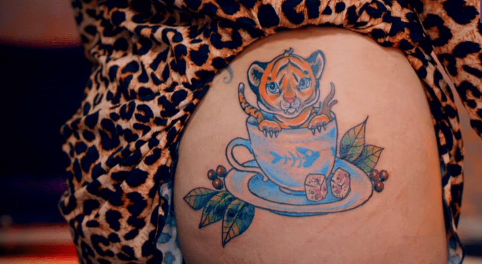  She decided to go for a "catified" tattoo of a tiger cub in a teacup