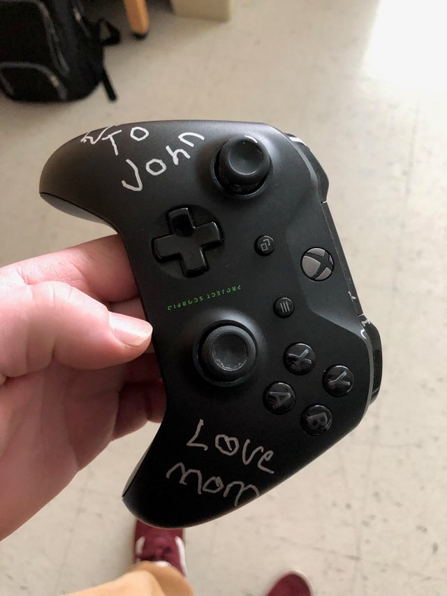  A mum signed her adult son's Xbox controller with a sweet message before she died