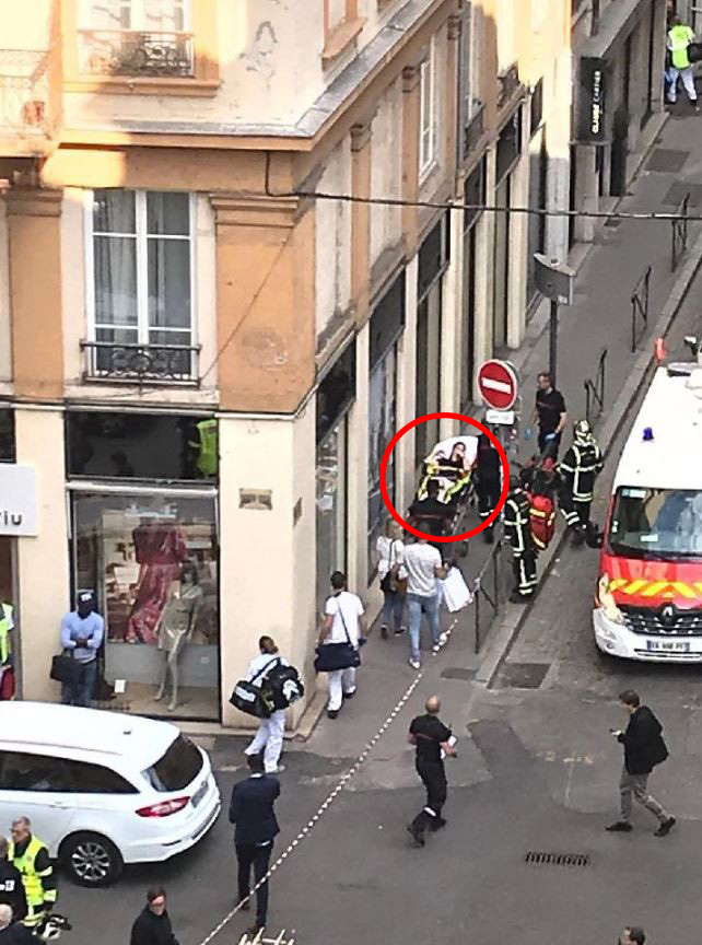  A woman is carried away in a stretcher following the bomb assault in Lyon this afternoon