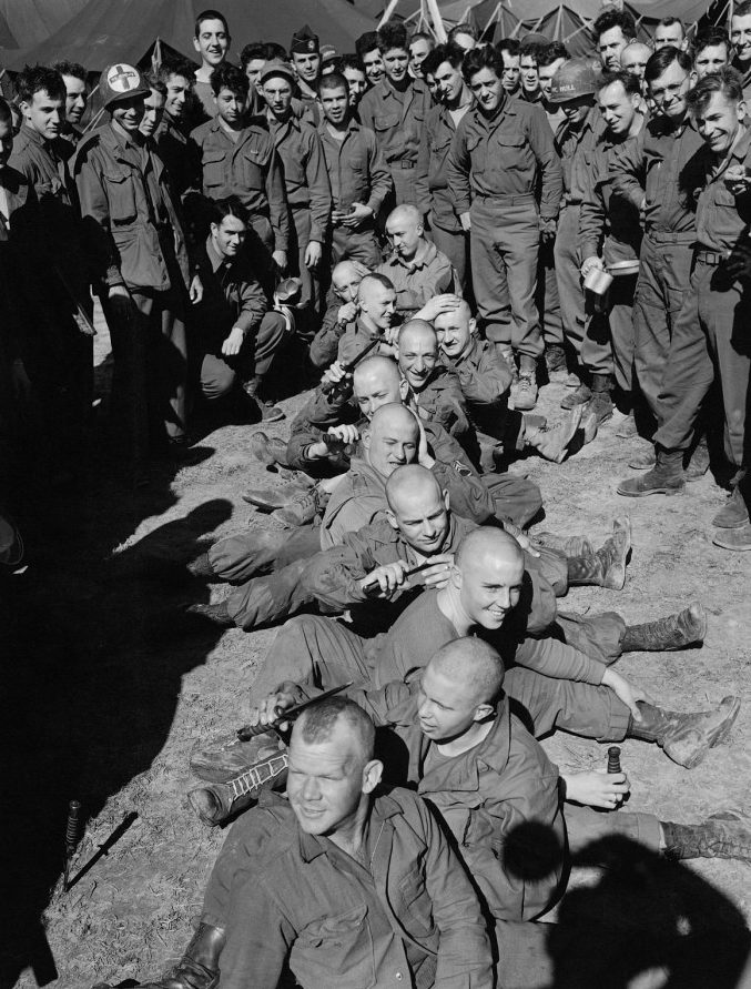  In a display of youthful bravado, US paratroopers at an airfield in England pose with shaved heads and scalp locks