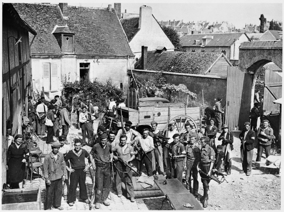  Following the Allied landings in June 1944, many men who had been uncommitted joined the Resistance, forming groups like this one in a French courtyard