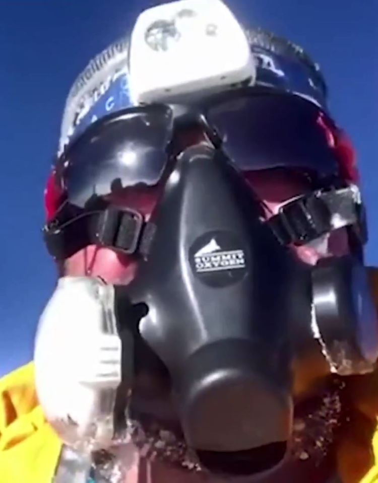  Former paratrooper Martin Hewitt shared a video of himself near the summit of Everest on Saturday saying he had to 'overtake well over a hundred climbers so we didn't run out of oxygen'