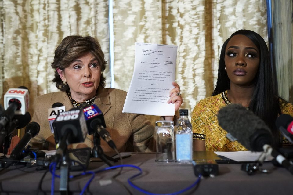  Attorney Gloria Allred holds up a copy of the lawsuit brought by Faith Rodgers against R Kelly