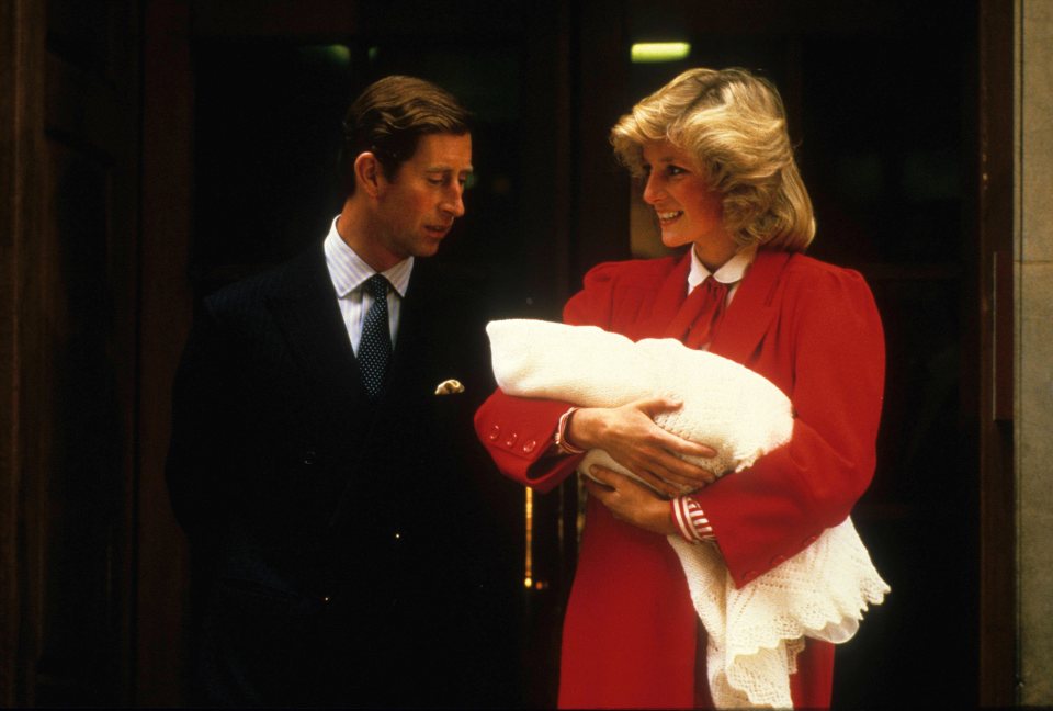 Princess Diana is seen cradling Prince Harry shortly after he was born