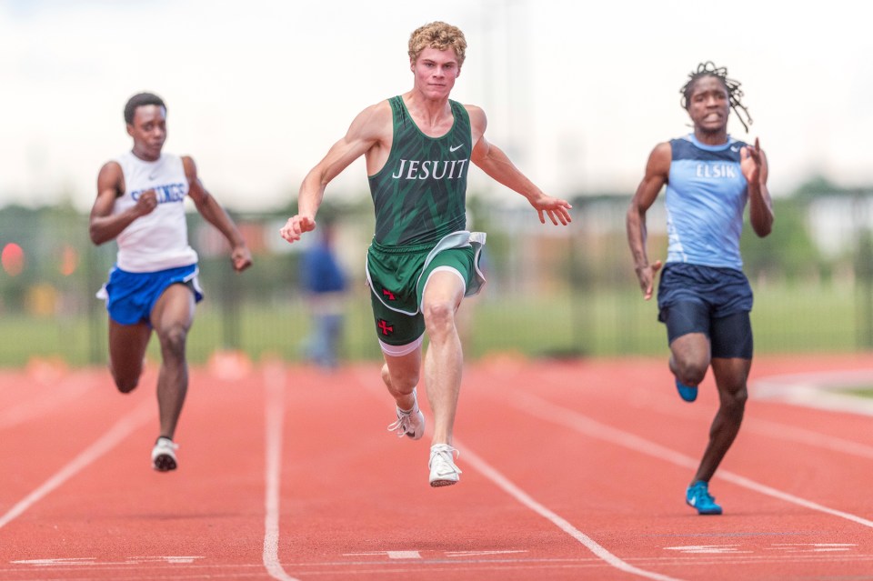 Matthew Boling, centre, won a high school race in Texas but also recorded the fastest American high school time ever