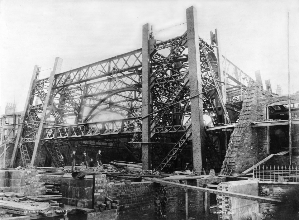  Workmen inspect the tower during the early days of the project