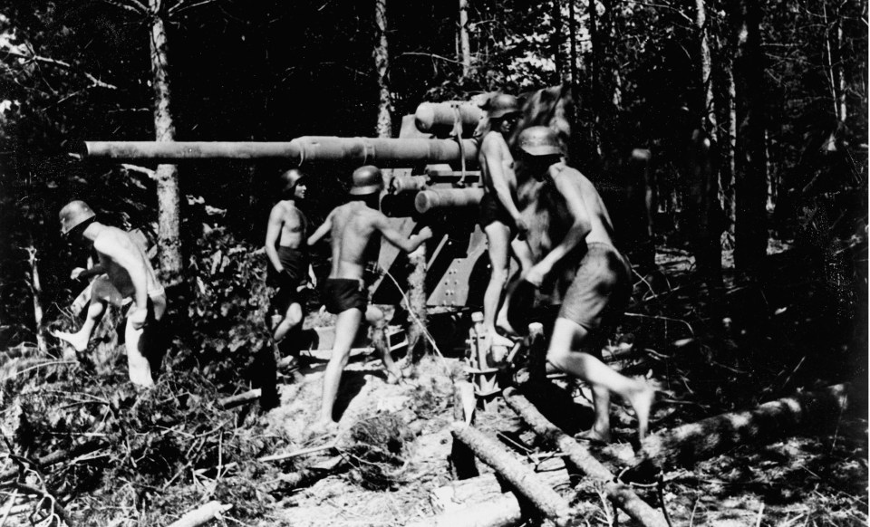  This photo shows a Luftwaffe FlaK crew wearing only underwear preparing their 8.8cm weapon