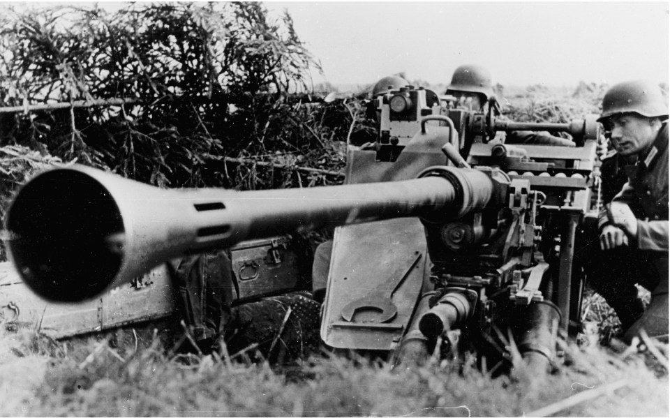  A gun crew preparing their weapon for a fire mission during defensive measures in the summer of 1944