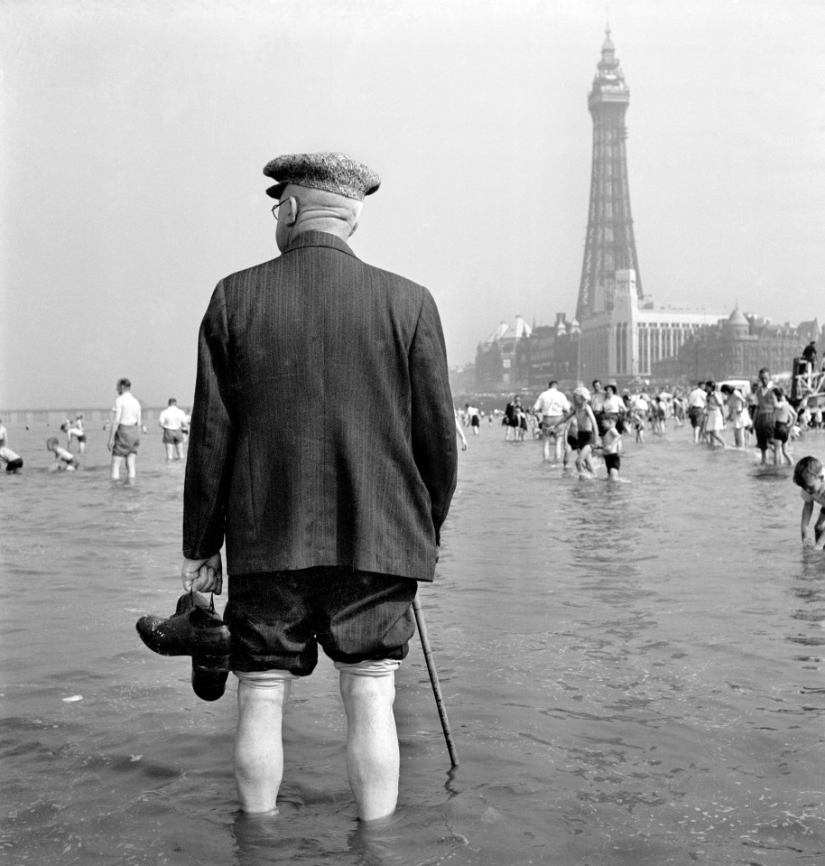  An elderly man paddling in the sea at Blackpool c1946-c1955 with the Blackpool Tower in the background