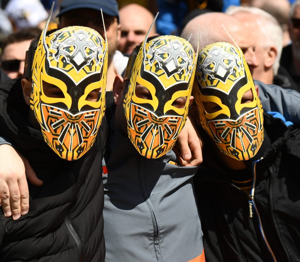 Wolves fans copy the way striker Raul Jimenez has celebrated some goals - by wearing a mask of Mexican wrestler Sin Cara