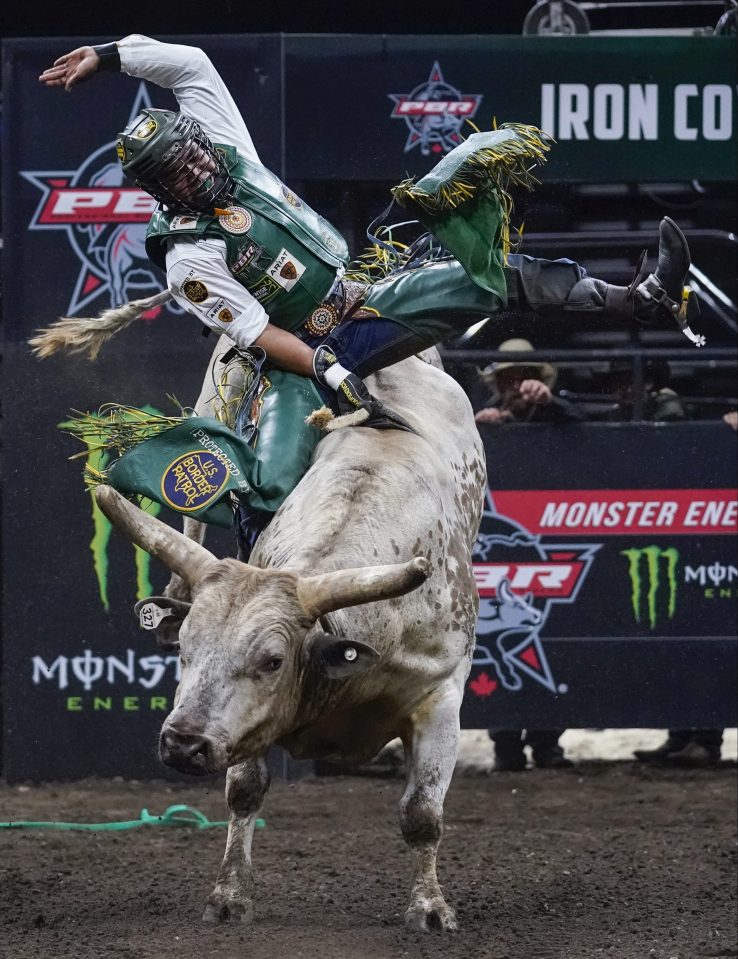  American rider Keyshawn Whitehorse rides his bull, Rehab, during the PBR Monster Energy Tour Professional Bull Riders event at Videotron Centre on May 4 in Quebec City, Canada