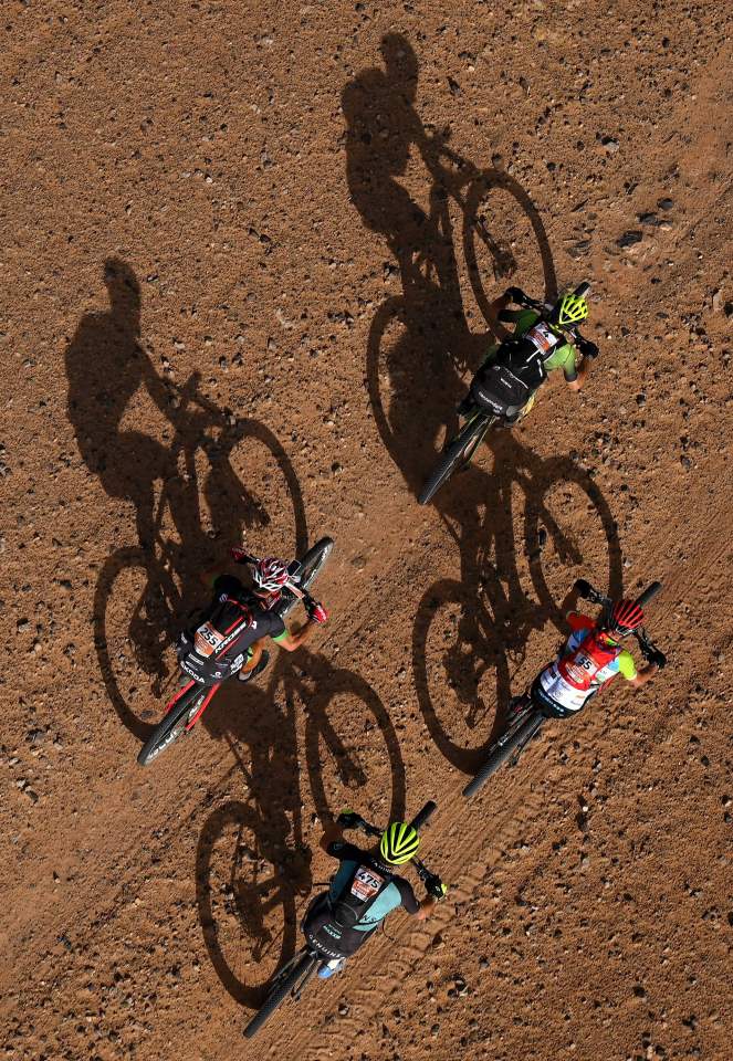  Competitors ride their bikes during Stage 4 of the 14th edition of Titan Desert 2019 mountain biking race between Merzouga and Mssici, in Morocco, on May 1